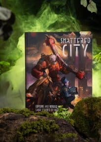 Shattered City front cover on a mossy rock with foliage and green lighting ©SHAW STUDIO