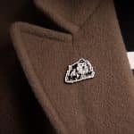 Honey Heist Bear pin on a coat lapel