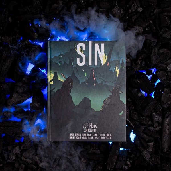 Sin front cover on black coals with smoke and blue lights © SHAW STUDIO