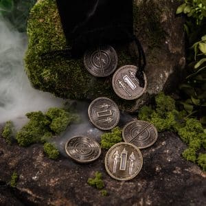 Fair Gold Coins with black pouch for DIE RPG surrounded by green foliage and smoke ©SHAW STUDIO