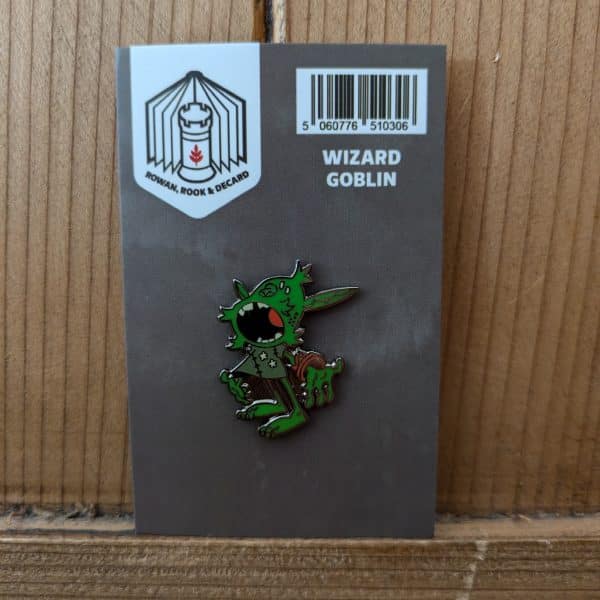 Wizard Goblin pin affixed to cardboard packaging